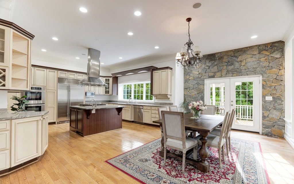 Chef's kitchen with stone accent wall